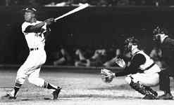 Hank Aaron hitting a home run